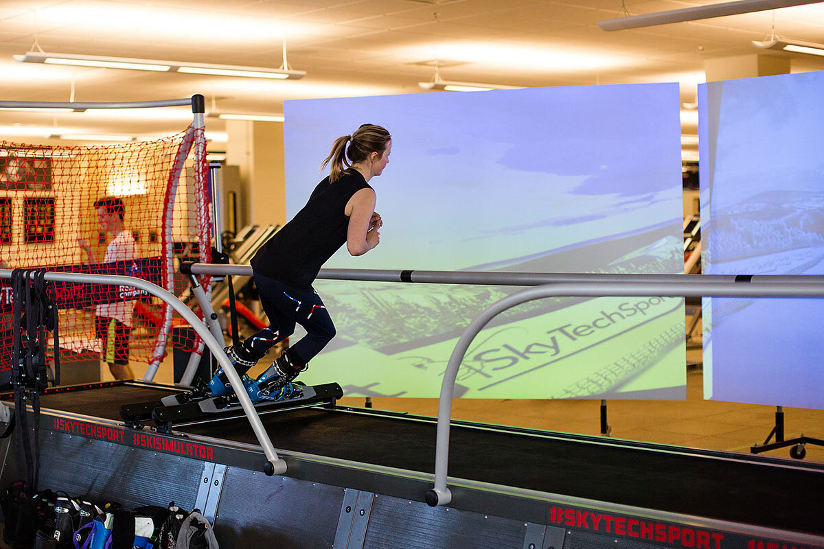 Olympic athlete training on an indoor ski simulator during summer conditioning
